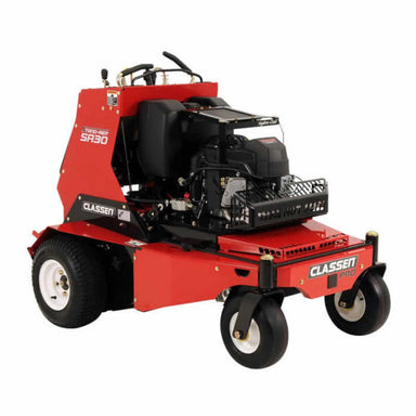 Main view of the Classen SA-30A PRO Stand-On Aerator showing its red body, Vanguard engine, large rear tires, swivel front wheels, and operator platform. Designed for commercial use with ergonomic controls and visible Classen PRO and SA-30 branding.