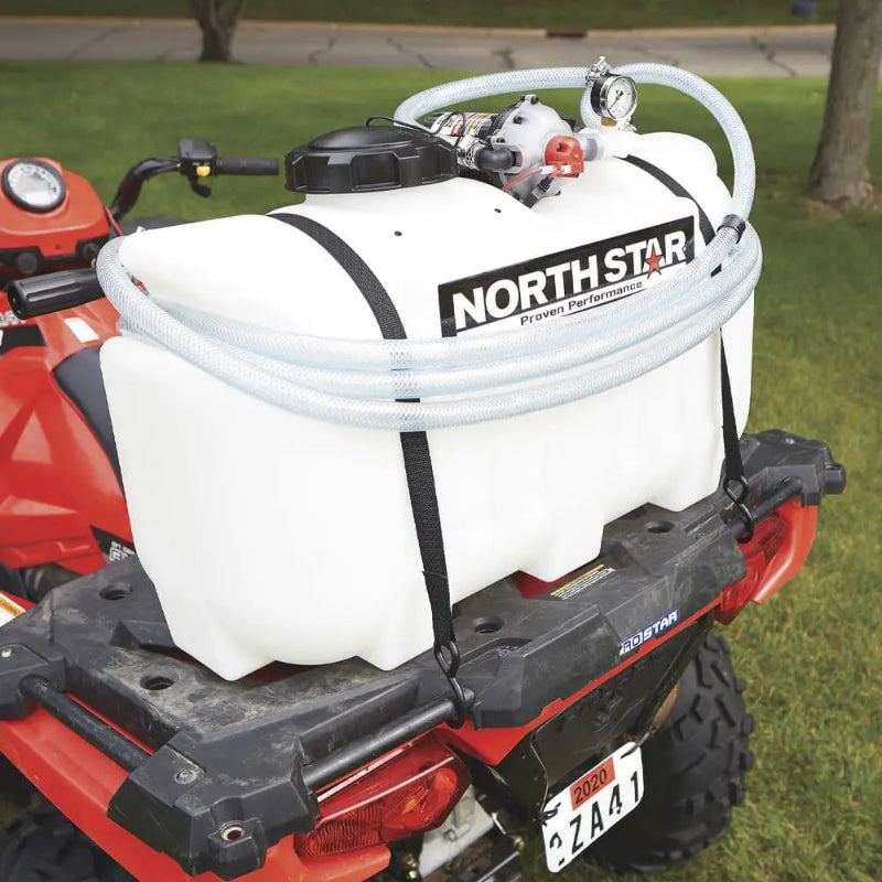 NorthStar 12V spot sprayer mounted on ATV rear rack, featuring a durable polyethylene tank, hose, and 12-volt pump for efficient pesticide or herbicide spraying.