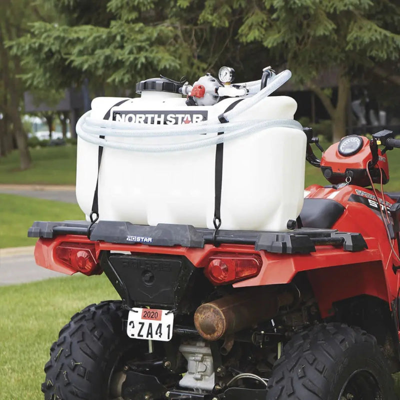 NorthStar 12V ATV sprayer securely mounted on a red ATV, featuring a high-capacity tank, pressure gauge, and hose for spot spraying and field applications.