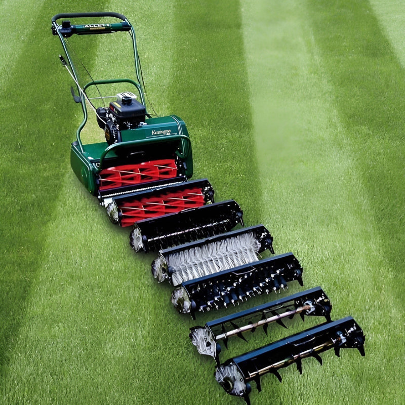 Allett Kensington 20H petrol cylinder mower displayed with its full range of interchangeable cartridges, including scarifier, brush, and aerator attachments, on a neatly striped lawn.