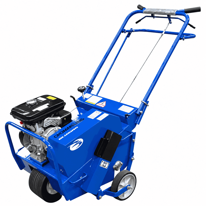 Crommelin 530HP Bluebird Lawn Aerator 19 shown from a front angled view on a white background, featuring the petrol engine, blue steel housing, operator handles, control cables, transport wheels and front protective frame.
