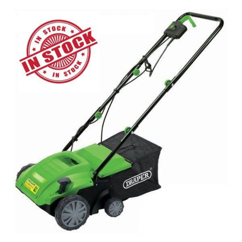 Front-angled view of the Draper Tools 2 in 1 Lawn Aerator/Scarifier featuring a green body, grey wheels, and black mesh catcher with Draper logo. Shown on a white background with a red “In Stock” stamp in the corner.