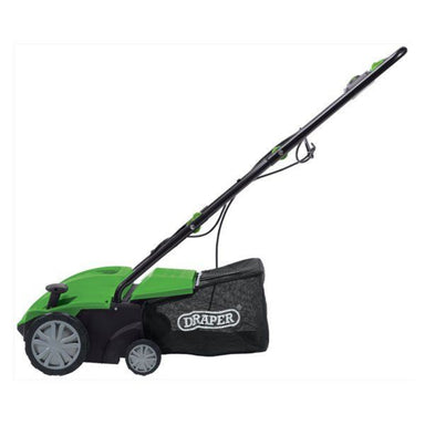 Side profile of the Draper Tools 2 in 1 Lawn Aerator/Scarifier showing its green body, grey wheels, black mesh grass bag with Draper logo, and extended black handle. Displayed on a clean white background, highlighting its slim, lightweight lawn-care design.