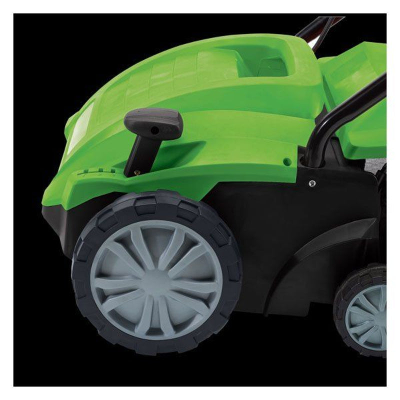 Close-up of the Draper Tools 2 in 1 Lawn Aerator/Scarifier showing the large grey front wheel, black tread, and green curved body panels, captured against a solid black background to highlight the wheel design and lower frame details.