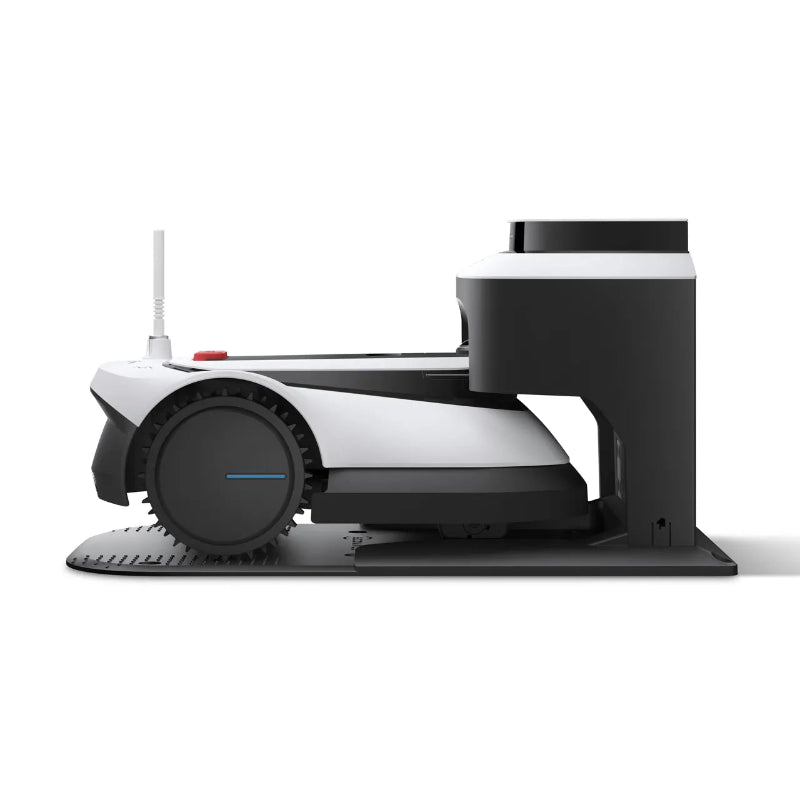 ECOVACS GOAT G1 Robotic Lawn Mower docked in its charging station on a white background. Wire-free robotic mower automatically recharges between mowing sessions, providing continuous, hands-free lawn maintenance for residential gardens.
