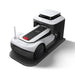 Angled view of the ECOVACS GOAT G1 Robotic Lawn Mower docked in its charging station. Wire-free robotic mower automatically recharges after mowing, ensuring continuous operation and convenient hands-free lawn maintenance for residential gardens.
