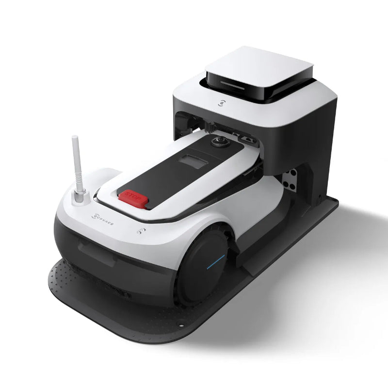 Angled view of the ECOVACS GOAT G1 Robotic Lawn Mower docked in its charging station. Wire-free robotic mower automatically recharges after mowing, ensuring continuous operation and convenient hands-free lawn maintenance for residential gardens.