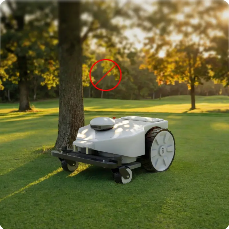 FJD FRX Robotic Lawn Mower operating beneath tree cover on a golf course, demonstrating reliable navigation and precise mowing performance in shaded areas where satellite signals may be limited