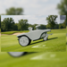FJD Titan Robotic Mower climbing a 20° slope on a golf course, demonstrating stable traction, autonomous navigation, and reliable commercial mowing performance across sloping fairways, sports fields, parks, and other challenging turf environments.