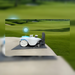 FJD Titan Robotic Mower automatically recharging at its docking station on a golf course, enabling autonomous charging and resume functionality for continuous commercial mowing, maximum uptime, reduced manual intervention, and efficient large-scale turf maintenance.