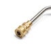 The image displays a close-up view of the end of a high-pressure washer extension wand, featuring a brass quick-connect coupling. The wand itself appears to be made of stainless steel, and the brass fitting shows a textured, knurled surface for grip. This type of quick-connect fitting, often 1/4" in size, is commonly used to attach various accessories like nozzles or other extensions to pressure washer spray guns or lances. 