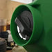 Close-up view of FlowZone Monsoon 2.5 sprayer control dial, black switch with white markings embedded in green plastic casing, photographed indoors with blurred background, designed for adjusting power and spray settings on the battery trolley sprayer.