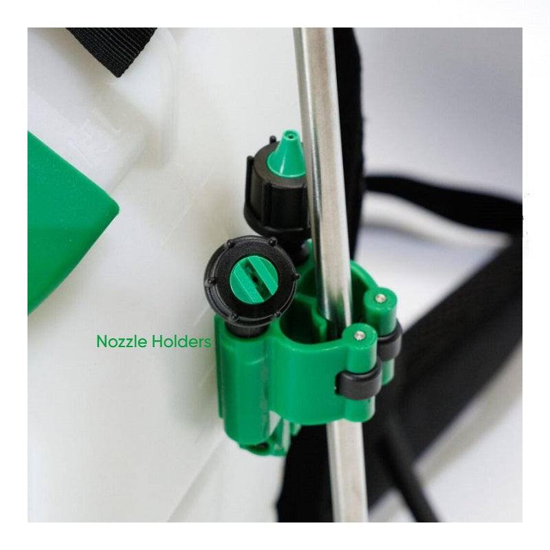 The image displays a close-up of green plastic nozzle holders attached to a metal wand, which is part of a larger piece of equipment, likely a backpack sprayer. The text "Nozzle Holders" is visible, indicating the function of the green clip-like components, which are designed to secure sprayer nozzles or the spray wand itself. The background shows part of a white tank and black straps, consistent with a backpack sprayer design. 