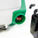 Close-up view of the FlowZone Zephyr 3 15L battery-powered sprayer showing the red on/off power switch housed in a green casing at the base of the tank. Battery pack and accessories are partially visible in the background.