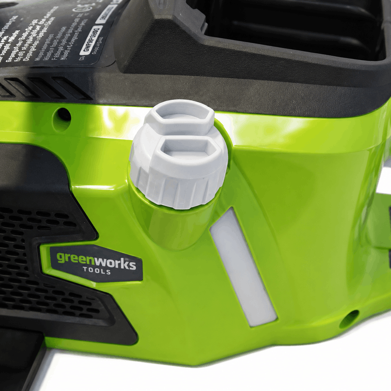 Greenworks 40V Brushless Chainsaw close-up showing the quick tool-free chain tension adjustment knob on the cordless chainsaw body, providing fast chain maintenance, easy adjustments, and reliable cutting performance for pruning and firewood preparation.