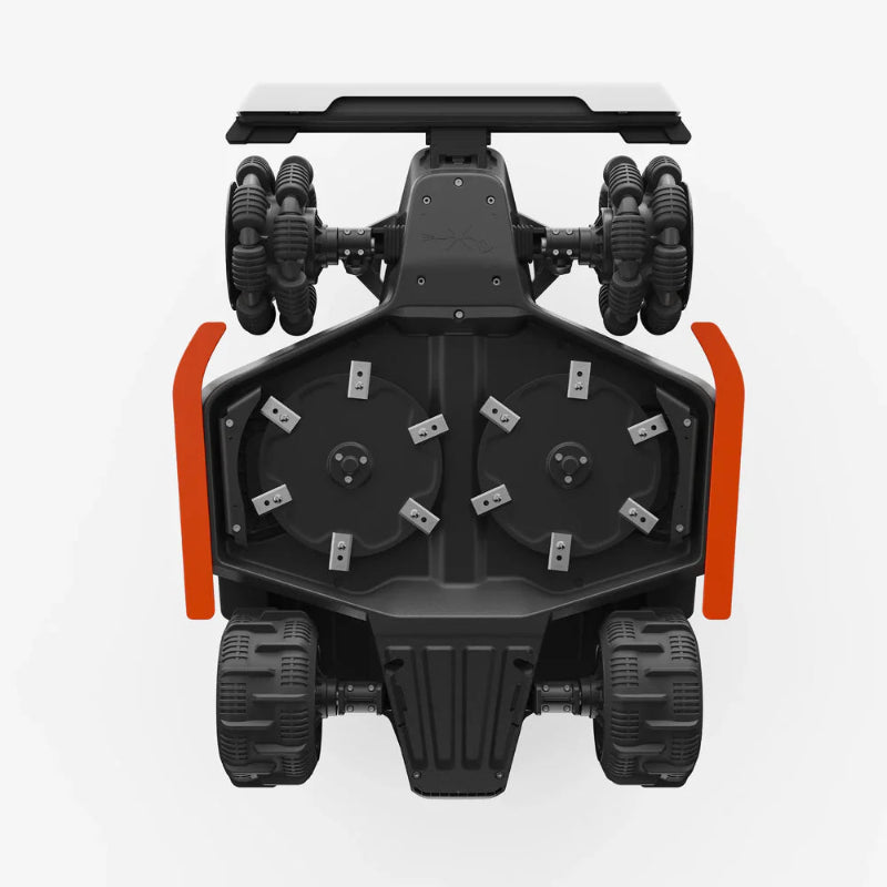 Bottom view of Mammotion Luba AWD X robotic mower showing dual rotating cutting discs with multiple sharp blades. The black and orange design highlights its precision mowing system, built for efficient grass cutting on varied terrains.