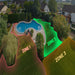Aerial view of a landscaped backyard with a pool, trees, and lawn divided into three mowing zones outlined in red, green, and yellow. The zones demonstrate the Mammotion Luba AWD X robotic mower’s smart multi-zone mowing capability.