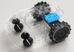 A transparent render of the Mammotion YUKA Mini robotic mower reveals its internal design, showcasing a bright blue lithium battery pack and motor components attached to large black wheels on a clean white background.