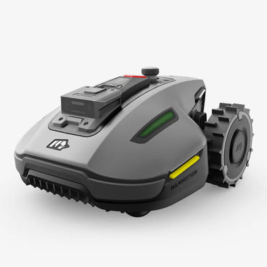 Compact Mammotion Yuka Mini robotic lawn mower in sleek gray with rugged wheels and advanced front sensors, designed for precise and efficient grass cutting on residential lawns.