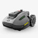 Compact Mammotion Yuka Mini robotic lawn mower in sleek gray with rugged wheels and advanced front sensors, designed for precise and efficient grass cutting on residential lawns.