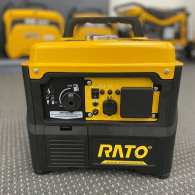 The image displays a compact, portable inverter gasoline generator, predominantly colored in black and yellow. The top section, including the handle and control panel, is yellow, while the main body and base are black. The front of the generator features a control panel with various switches, outlets, and indicators, including an "OFF" switch, an "AIR FILTER" compartment, and what appears to be a fuel gauge or cap.