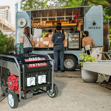 Rato R8750iD inverter generator powering a food truck at an outdoor event. Heavy-duty portable generator with wheels and outlets, ideal for commercial use, catering, events, and backup power where reliable electricity is needed on the go.