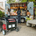 Rato R8750iD inverter generator powering a food truck at an outdoor event. Heavy-duty portable generator with wheels and outlets, ideal for commercial use, catering, events, and backup power where reliable electricity is needed on the go.