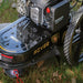 Close-up of Rato RCV22 high wheel trimmer showing heavy-duty steel deck, OHV engine, air filter, and wide tread wheels. Branding clearly visible with RCV22 logo. Designed for trimming tall grass, weeds, and rough vegetation with durable performance.