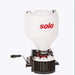 Solo handheld granulate spreader featuring a large white hopper, black base, and side hand crank for even distribution of seeds, salt, or fertiliser.