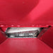 The image shows the internal mechanism of a chipper, specifically the cutting blades and the chute through which material is fed or processed.