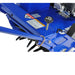 Close-up view of Crommelins 530HP Bluebird 19-inch lawn aerator, showing blue steel frame, adjustment knob, warning labels, and visible coring tines beneath, photographed on a plain white background for detailed inspection of controls and components.